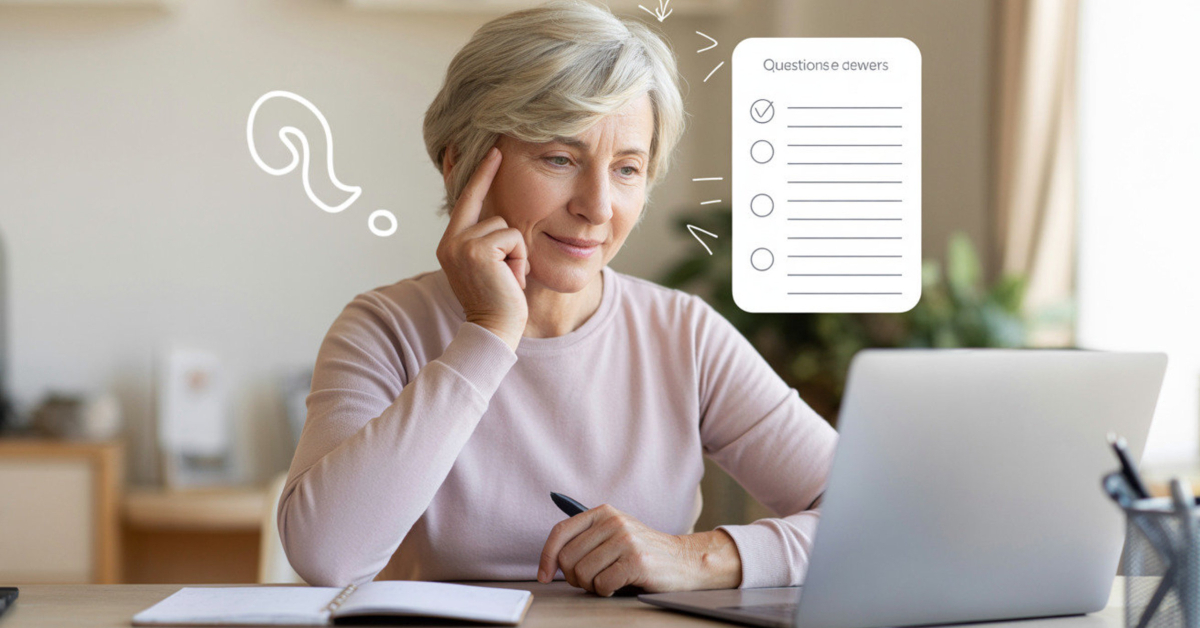 Retiree reviewing questions and answers while using a laptop in a calm home workspace